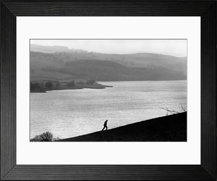 Framed Print : A man walks up a hill above Bala Lake, Gwynedd. North Wales Framed Print : A man walks up a hill above Bala Lake, Gwynedd. North Wales