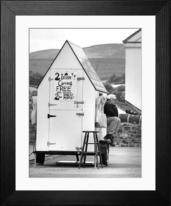 Framed Print : Attendant sits on mobile Boat Hire ticket office, Killaloe Framed Print : Attendant sits on mobile Boat Hire ticket office, Killaloe