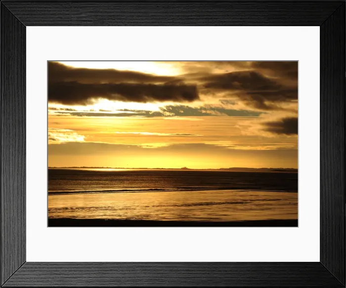 Framed Print : Dark stormy skies above Bamburgh Castle, Northumberland Framed Print : Dark stormy skies above Bamburgh Castle, Northumberland