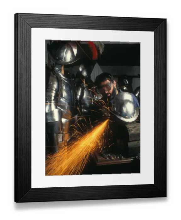 Framed Print : Craftsman puts finishing touches to replica suit of armour Framed Print : Craftsman puts finishing touches to replica suit of armour