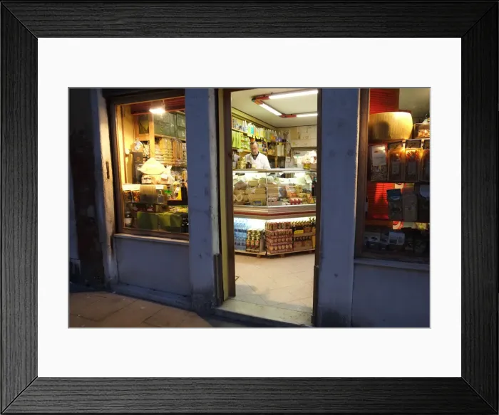 Framed Print : Shopkeeper in delicatessen at night, Via Garibaldi, Venice Framed Print : Shopkeeper in delicatessen at night, Via Garibaldi, Venice