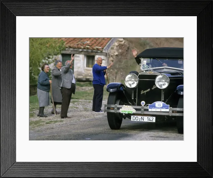 Framed Print : Local people wave to driver of a vintage Hispano Suiza car