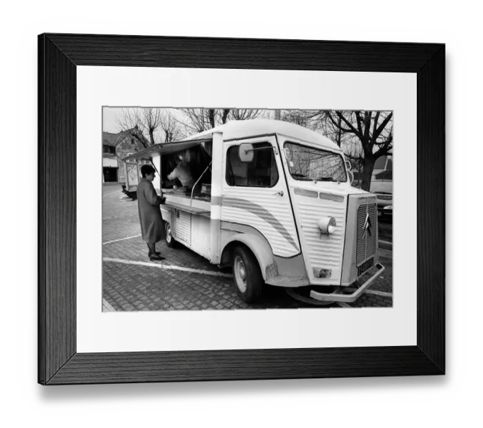 Framed Print : A woman buys meat from a mobile shop in Neuville Sur Oise Framed Print : A woman buys meat from a mobile shop in Neuville Sur Oise