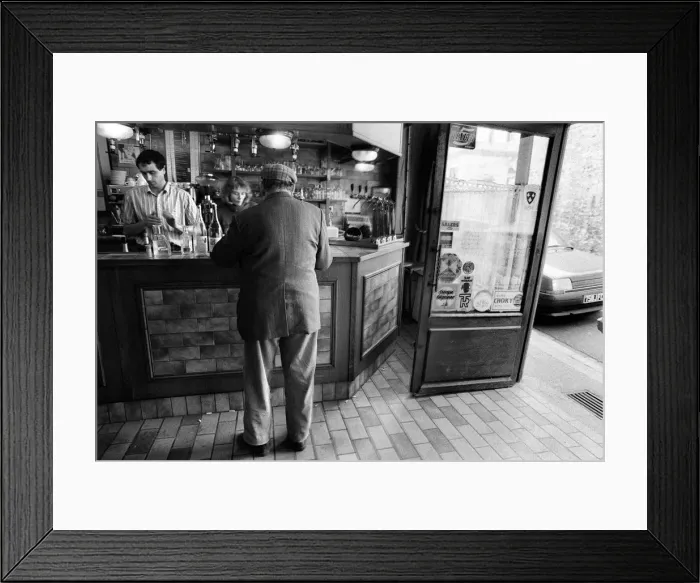 Framed Print : A customer is served in a bar in Luzarches, France Framed Print : A customer is served in a bar in Luzarches, France