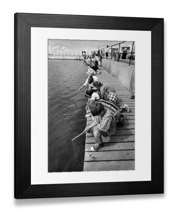 Framed Print : Children crabbing from a wooden pontoon at New Brighton Framed Print : Children crabbing from a wooden pontoon at New Brighton