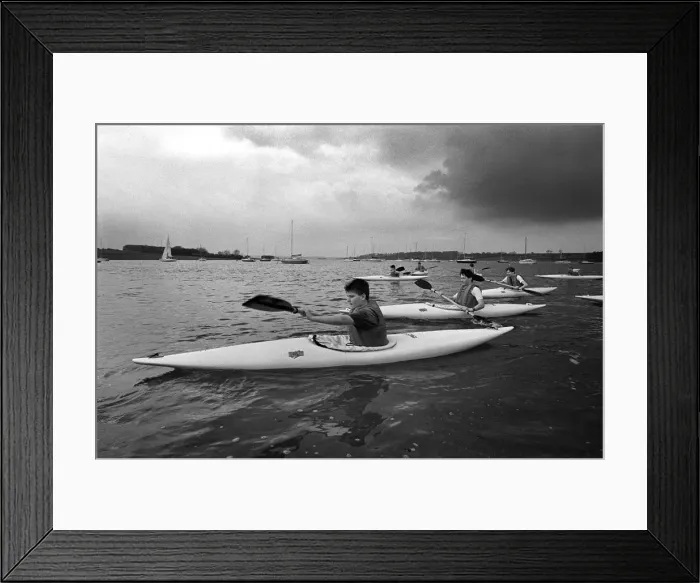 Framed Print : Teenagers paddle their canoes on Rutland Water, Leics Framed Print : Teenagers paddle their canoes on Rutland Water, Leics