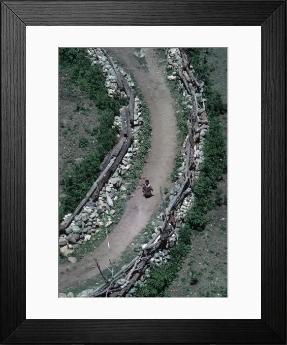 Framed Print : Kashmir, Sind Valley, small child running along village path Framed Print : Kashmir, Sind Valley, small child running along village path