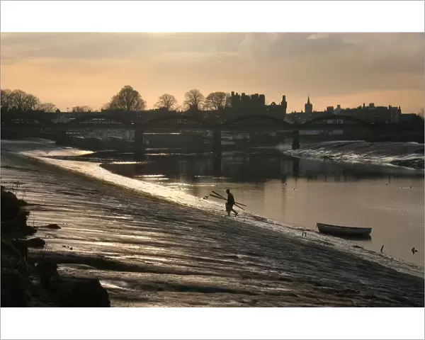 Lobster fisherman leaves boat and climbs bank of River Dee