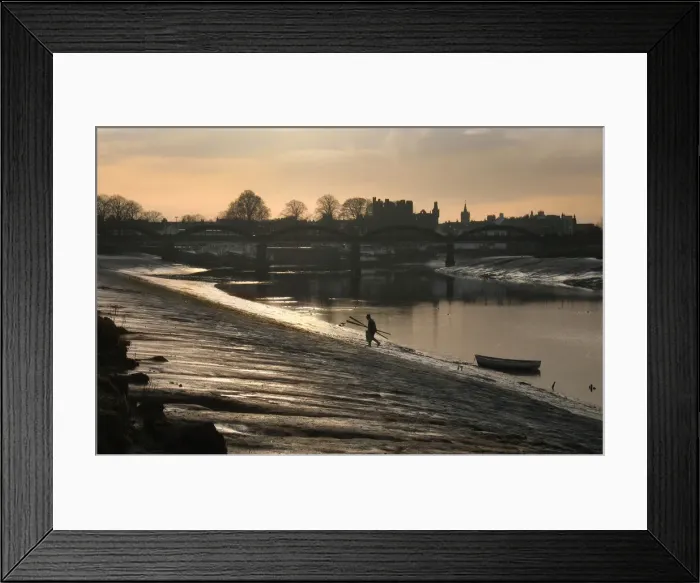 Framed Print : Lobster fisherman leaves boat and climbs bank of River Dee Framed Print : Lobster fisherman leaves boat and climbs bank of River Dee