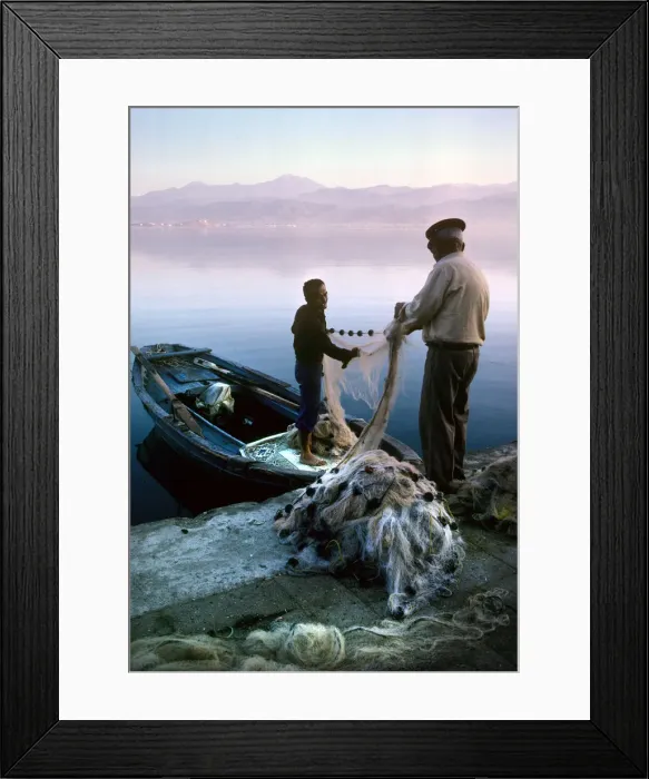 Framed Print : Two fishermen sort their nets on stone quayside - Fetheye Framed Print : Two fishermen sort their nets on stone quayside - Fetheye