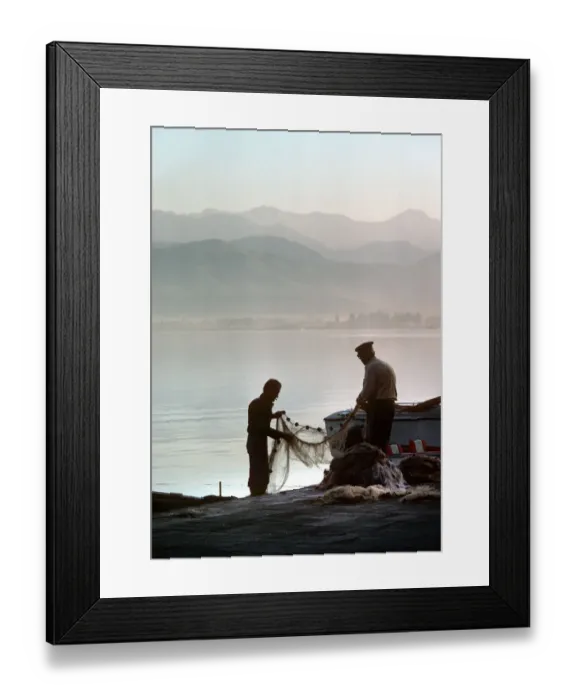Framed Print : Two fishermen sort their nets on stone quayside - Fetheye Framed Print : Two fishermen sort their nets on stone quayside - Fetheye