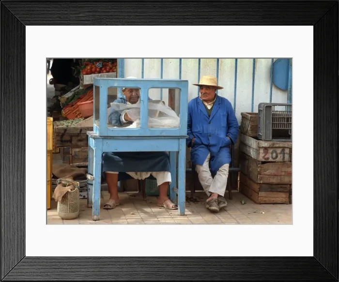 Framed Print : Man sits beside a small food stall in Houmt Souk, Djerba Framed Print : Man sits beside a small food stall in Houmt Souk, Djerba