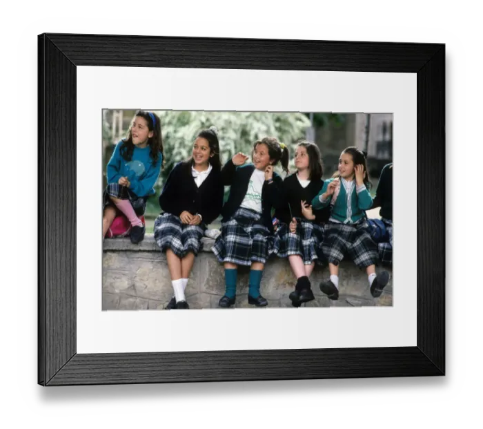 Framed Print : A group of happy schoolgirls wearing Spanish tartan skirts Framed Print : A group of happy schoolgirls wearing Spanish tartan skirts