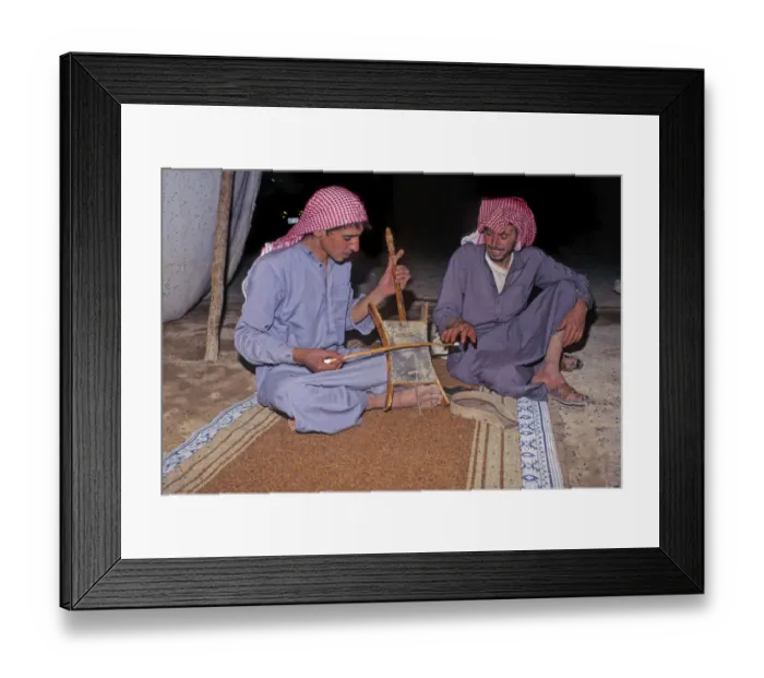 Framed Print : Bedouin men in tent in Syrian desert, one plays a rababah Framed Print : Bedouin men in tent in Syrian desert, one plays a rababah