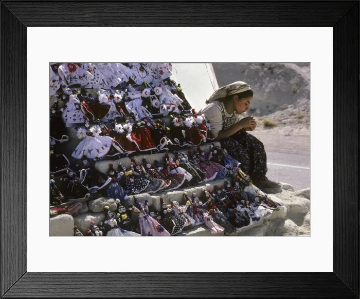 Framed Print : A young girl and her doll and trinket souvenir stall, Goreme Framed Print : A young girl and her doll and trinket souvenir stall, Goreme