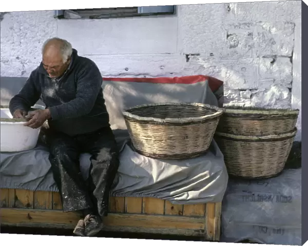 Basket maker, at work outside his house in Thassos, Greece