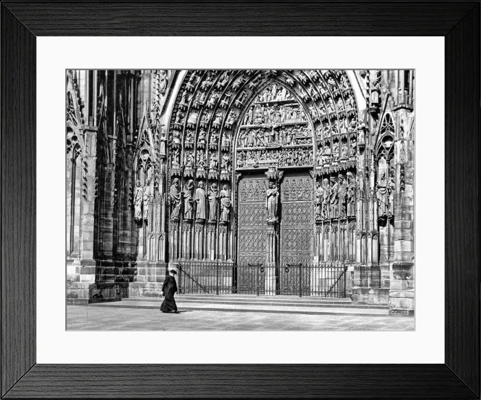 Framed Print : Priest walking in front of Strasbourg Cathedral, France Framed Print : Priest walking in front of Strasbourg Cathedral, France