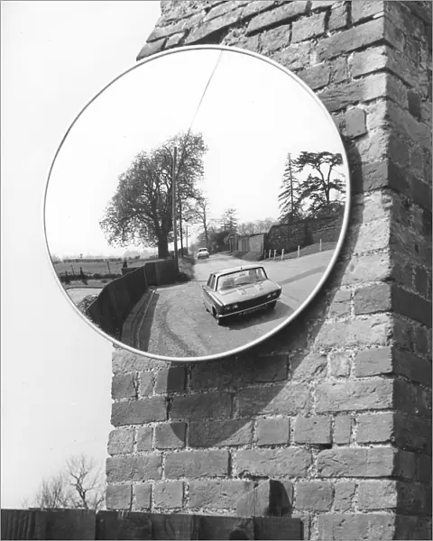 Large mirror on a wall at the roadside