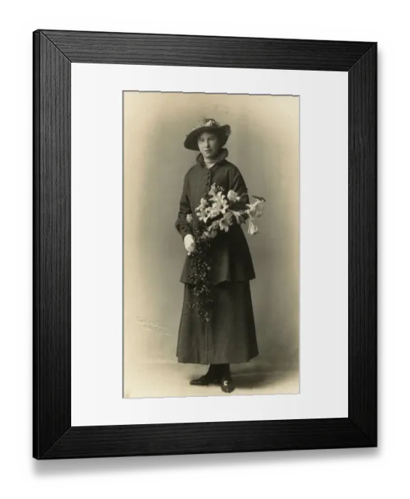 Framed Print : Pretty Young lady holding an elaborate bouquet Framed Print : Pretty Young lady holding an elaborate bouquet