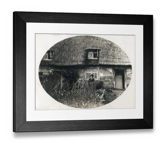 Framed Print : Elderly couple standing proudly outside their thatched English country cottage Framed Print : Elderly couple standing proudly outside their thatched English country cottage