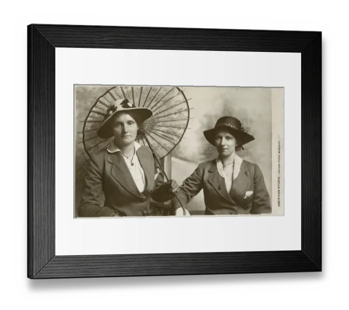 Framed Print : A Mother and daughter have a duo portrait photograph taken at the American Studio Framed Print : A Mother and daughter have a duo portrait photograph taken at the American Studio