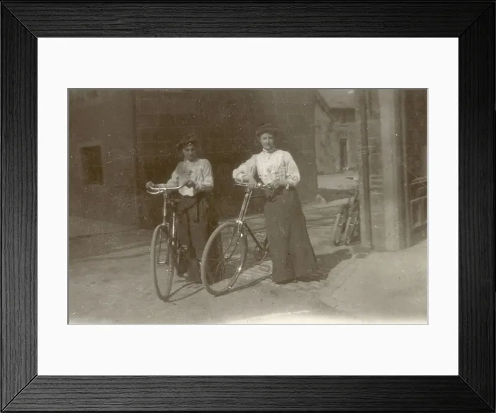 Framed Print : Two young women pose proudly with their bicycles at Moffat in Dumfriesshire Framed Print : Two young women pose proudly with their bicycles at Moffat in Dumfriesshire