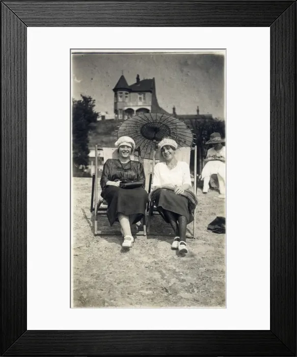 Framed Print : Two stylish ladies sat in deckchairs on the beach Framed Print : Two stylish ladies sat in deckchairs on the beach