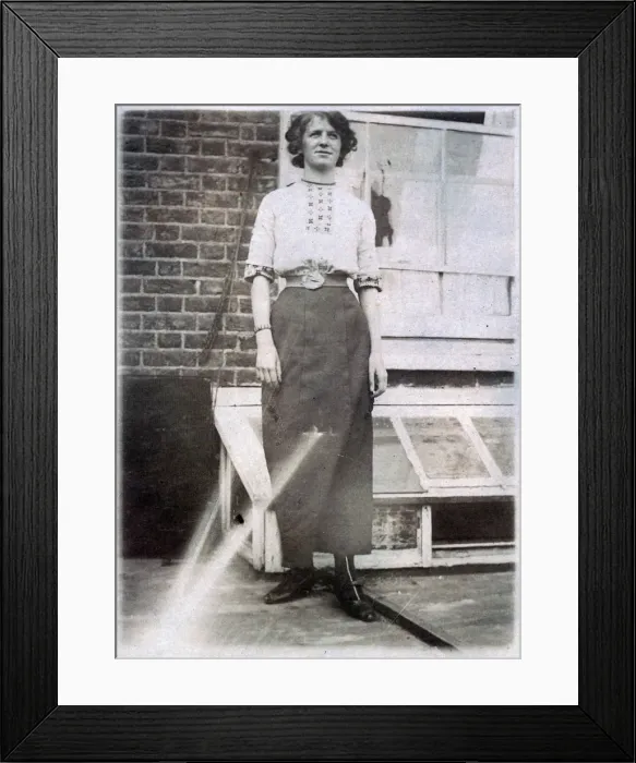 Framed Print : Young woman standing outside her home Framed Print : Young woman standing outside her home