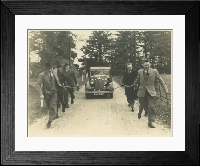 Framed Print : Men Towing Vintage Rover Car Framed Print : Men Towing Vintage Rover Car