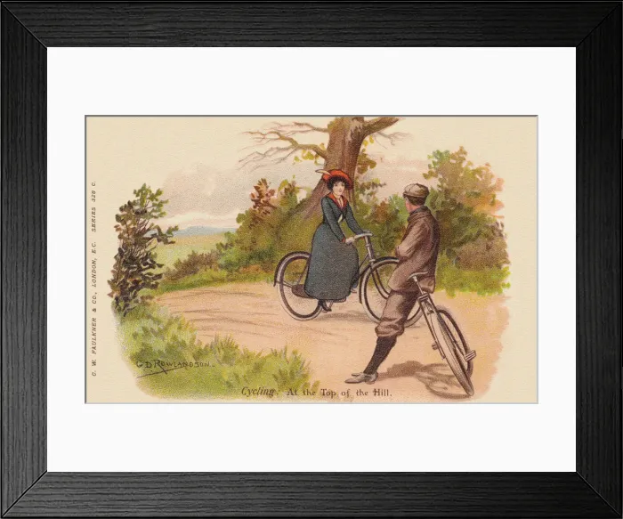 Framed Print : Cycling. Young couple cycling up a hill on a summers day Framed Print : Cycling. Young couple cycling up a hill on a summers day