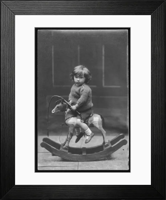 Framed Print : Boy on a rocking horse Framed Print : Boy on a rocking horse