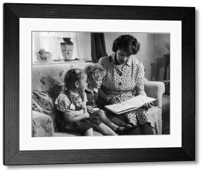 Framed Print : MOTHER READS TO CHILDREN Framed Print : MOTHER READS TO CHILDREN
