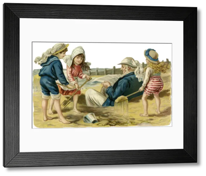 Framed Print : Children on beach bury grandpa in the sand Framed Print : Children on beach bury grandpa in the sand