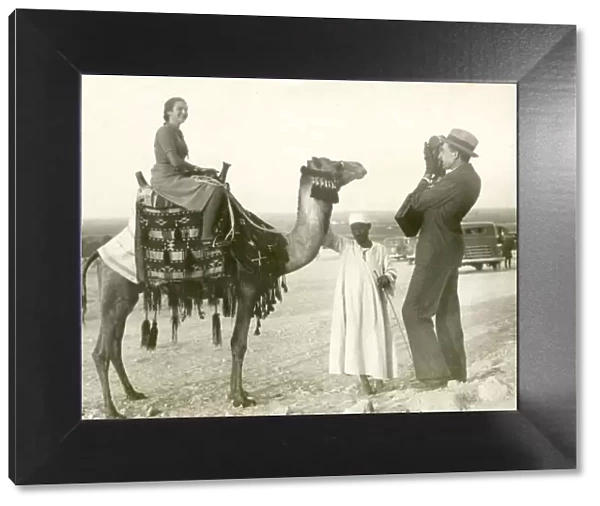 Lady Tourist on camel - Giza, Egypt