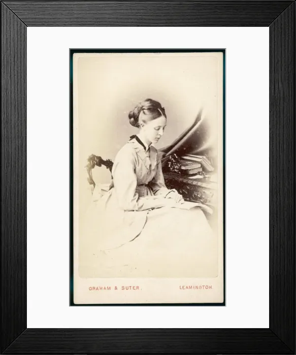 Framed Print : READING WITH BOOK ON LAP Framed Print : READING WITH BOOK ON LAP