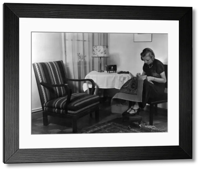 Framed Print : WOMAN WORKS ON TAPESTRY Framed Print : WOMAN WORKS ON TAPESTRY