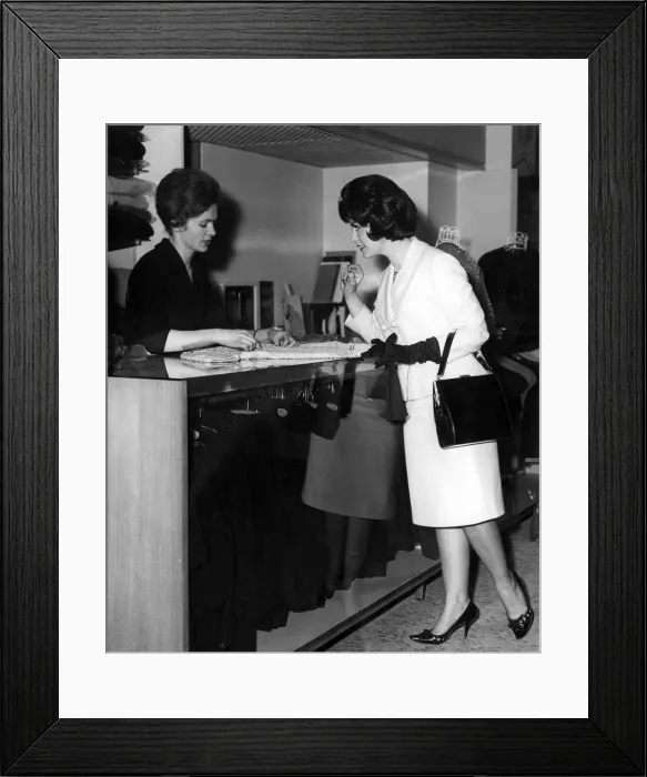 Framed Print : WOMAN BUYS KNITTED TOP Framed Print : WOMAN BUYS KNITTED TOP