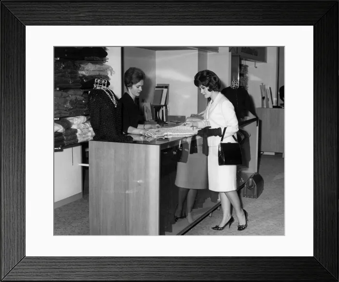 Framed Print : WOMAN BUYS KNITTED TOP Framed Print : WOMAN BUYS KNITTED TOP