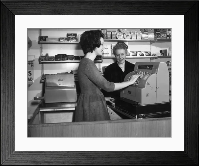 Framed Print : WOMAN USES CASH REGISTER Framed Print : WOMAN USES CASH REGISTER