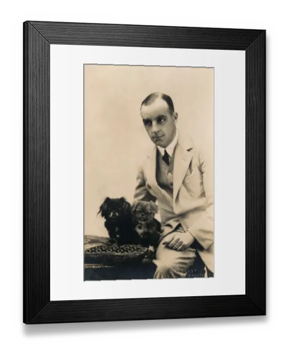 Framed Print : Studio portrait, man with Pekingese dog, France