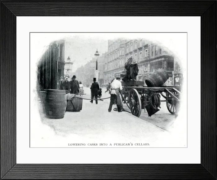 Framed Print : Lowering casks into cellar 1900