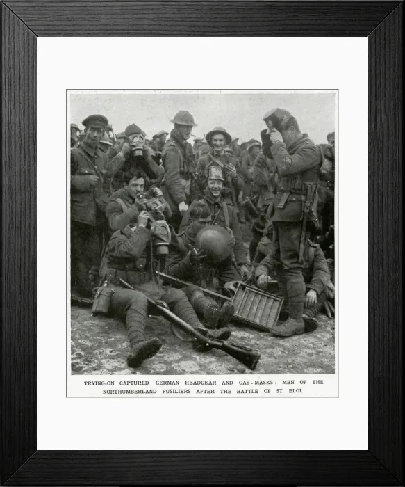 Framed Print : British soldiers trying on captured German headgear 1916 Framed Print : British soldiers trying on captured German headgear 1916