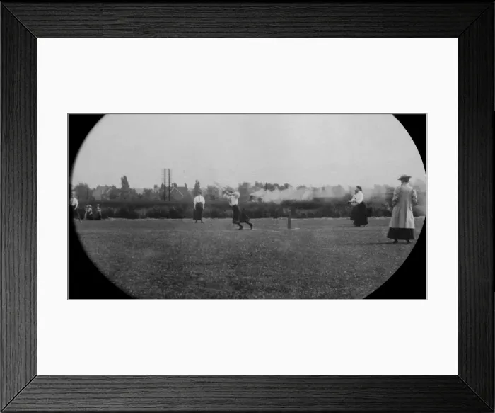Framed Print : Students playing cricket steam train in background