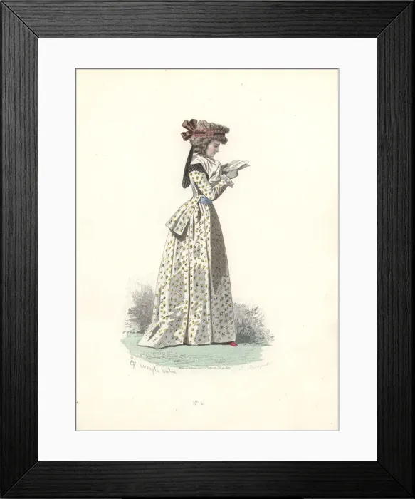 Framed Print : Fashionable woman in bonnet, wearing a floral print long dress and reading a book Framed Print : Fashionable woman in bonnet, wearing a floral print long dress and reading a book