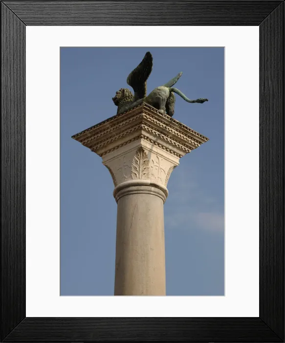 Framed Print : Winged lion statue of Saint Mark on a granite column in Framed Print : Winged lion statue of Saint Mark on a granite column in