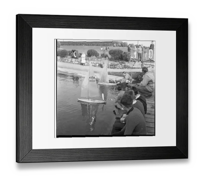 : People with model sailing boats on a pond : People with model sailing boats on a pond