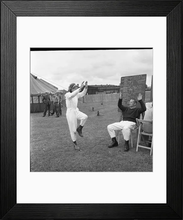 : Sky diver practising in a field : Sky diver practising in a field