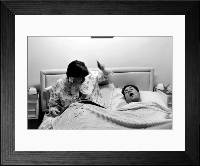 Framed Print : Woman with snoring husband Framed Print : Woman with snoring husband