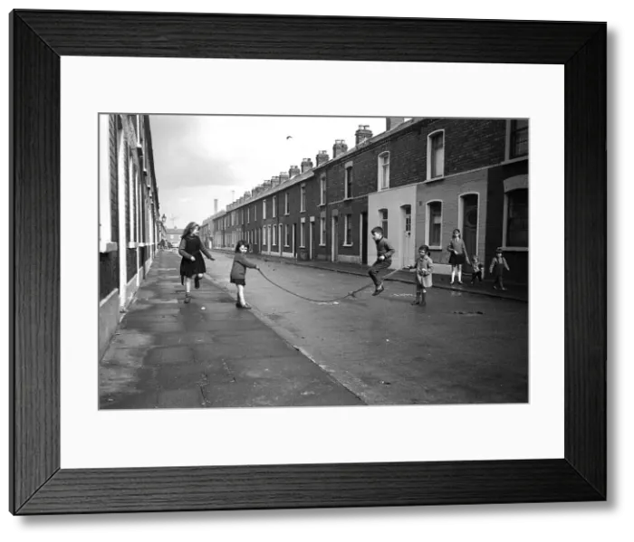 Framed Print : Children skipping in a street, Belfast, Northern Ireland Framed Print : Children skipping in a street, Belfast, Northern Ireland