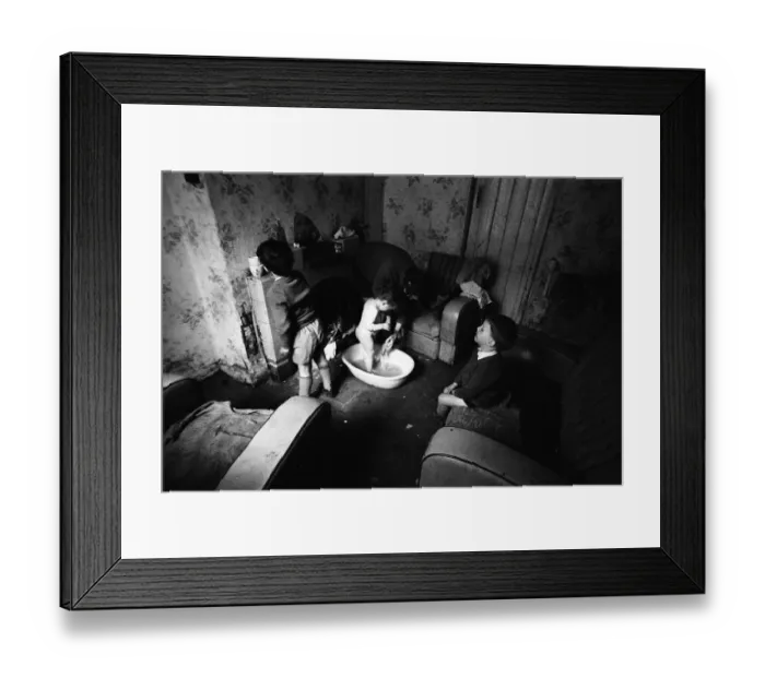 Framed Print : Woman bathing baby, Falls Road, Northern Ireland Framed Print : Woman bathing baby, Falls Road, Northern Ireland